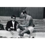 JIMMY ARMFIELD B/w 12 x 8 photo showing the Blackpool Captain signing an autograph for a young fan