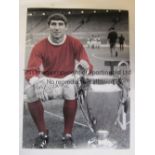 TONY DUNNE A colorized 16 x 12 photo depicting Dunne posing with the European Cup at Old Trafford