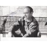 ALFREDO DI STEFANO A signed B/W picture postcard of Di Stefano sitting at the training ground. Good