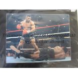 MIKE TYSON AUTOGRAPH Signed and mounted 20" X 16" colour picture of Mike Tyson in the ring.