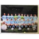 MANCHESTER CITY A col 16 x 12 photo of City’s squad of players posing with the Charity Shield, the