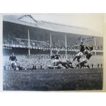 ROGER HUNT A b/w 16 x 12 photo of Hunt scoring for Liverpool against rivals Everton at Goodison Park