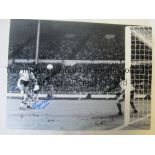 ROGER HUNT A b/w 16 x 12 photo of Hunt scoring one of his two goals in England’s victory over France