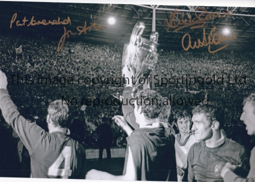 MANCHESTER UNITED A b/w 12 x 8 photo of the United players holding aloft the European Cup during a