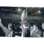 MANCHESTER UNITED A b/w 12 x 8 photo of the United players holding aloft the European Cup during a