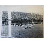 RON SPRINGETT A b/w 16 x 12 photo of an action scene as the English goalkeeper saves at the feet