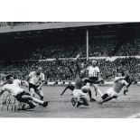 WOLFGANG WEBER B/w 12 x 8 photo of Weber scoring a last gasp equaliser against England in the 1966