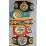 BOXING CHAMPIONSHIP BELTS Five belts. Full size WBC World Championship green replica belt with small