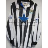 NEWCASTLE UNITED A home black & white long sleeve Asics shirt 1993-1995 with a blue star shirt