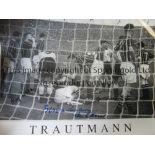 BERT TRAUTMANN Superb Limited edition photograph showing Bert Trautmann receiving treatment on the