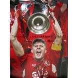 STEVEN GERRARD AUTOGRAPH A 16" X 12" colour photo, signed in black marker, of Gerrard lifting the