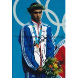AMIR KHAN AUTOGRAPH A colour 12" X 8" photo hand signed in black marker on the Olympic podium. Good