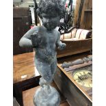 A lead garden figure in the form of a nude child.