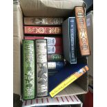 A box containing Folio Society books including several on exploration