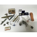 A group of various items comprising of largely Military badges, model boats and planes and others.