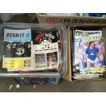 Two boxes of vintage football programs.