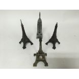 A group of model buildings, comprising of three Eiffel towers and a model of the Empire State