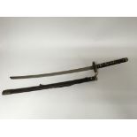 A reproduction Japanese katana sword, with scabbard and inscribed blade.
