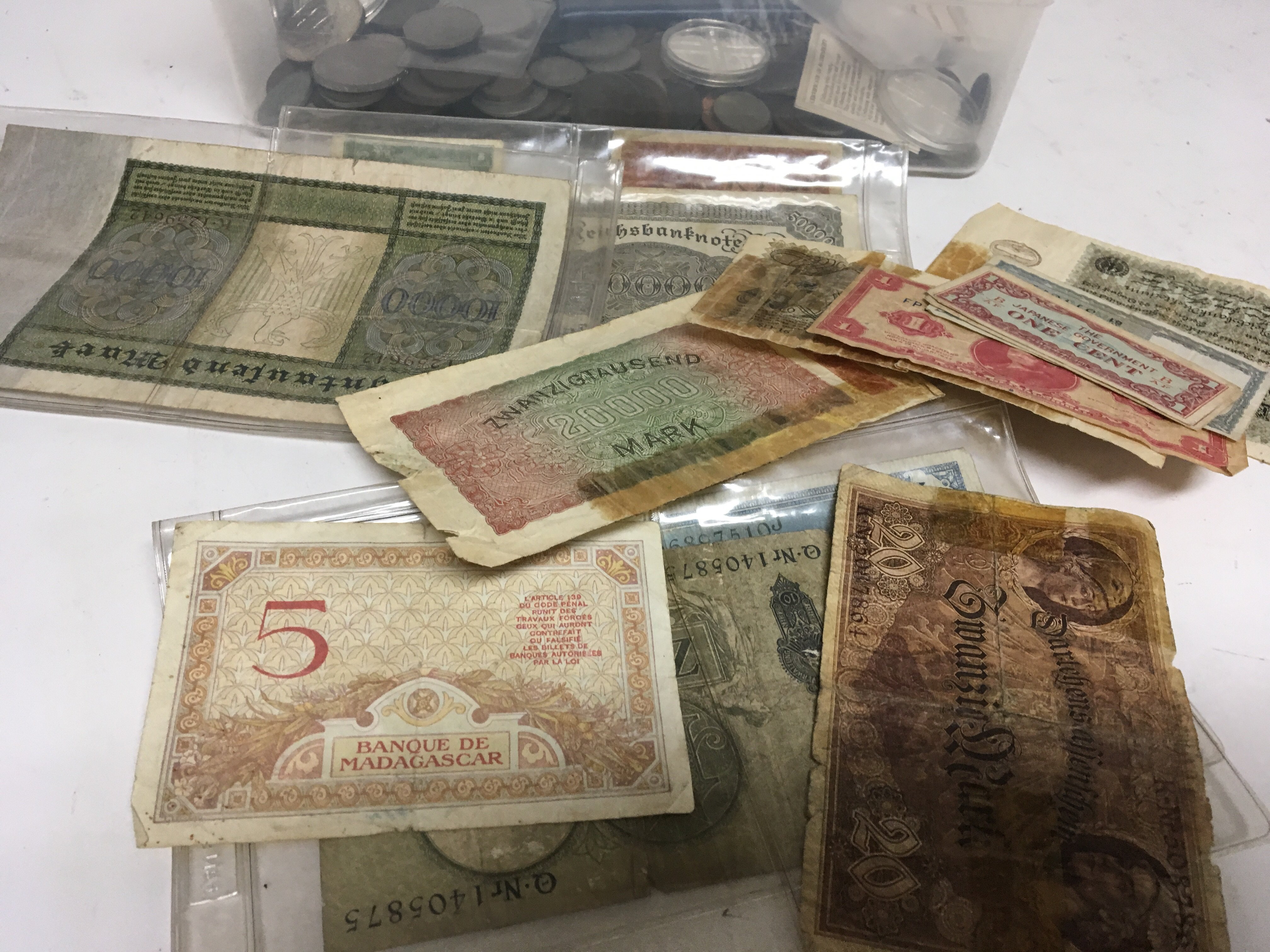 A collection of bank notes and used circulated wor