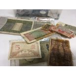 A collection of bank notes and used circulated wor