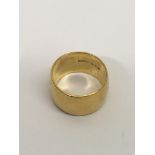 A wide, 22ct gold wedding band ring.Approx 12.3g,
