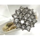 An 18ct gold and diamond cluster ring.Approx N