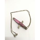 An unusual, silver and pink crystal shark pendant