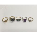 A collection of gold and costume jewellery rings.