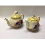 A pair of Clarice Cliff crocus pattern tea pots.