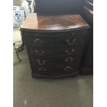 A small mahogany bow fronted chest of drawers with