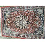 A Persian part silk hand knotted rug with a floral