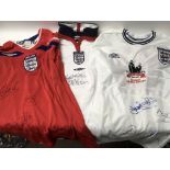 A group of three England football shirts, includin