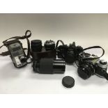 A collection of cameras and lenses.