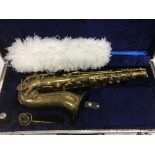 A cased saxophone and a accessories, no maker's na