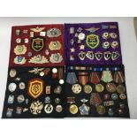 A collection of later military cap badges, patches