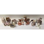 A collection of 14 Royal Crown Derby paperweights.