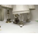 A pair of cut glass and brass table lamps one othe