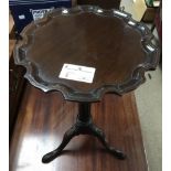 A small mahogany occasional table on tripod leg