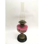 A painted glass oil lamp