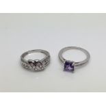 Two white gold diamond rings set with coloured sto