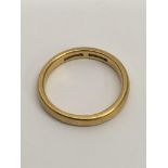 A 22ct gold wedding band ring. Approx 6.7g, T