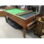A bar billiards table and accessories.
