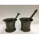 Two similar bronzed pestle and mortars.