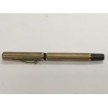 A 9ct gold Waterman fountain pen.