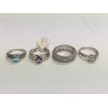 Four white gold rings set with stones, approx 12.4