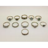 A collection of 9ct gold rings set with diamonds a