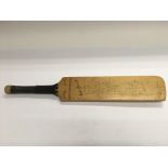 A small cricket bat, signed by the 1967 England an