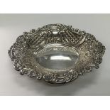 A silver dish with repousse work decoration, Londo
