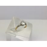 An 18ct gold ring inset with a single solitaire di