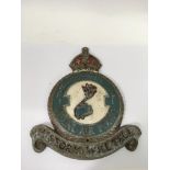 A painted metal Royal Air Force wall plaque